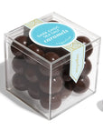 Box of dark chocolate sea salt caramels with a label on a white background