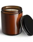 Brown glass candle jar with a black lid on a white background