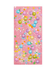 Pink beach towel with colorful bubble pattern on a white background