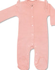 Pink baby onesie with buttons on a white background
