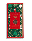 A packaged hazelnut crèpe milk chocolate bar in a festive Christmas-themed box by sugartina. The box features a dark green background decorated with gold bows, nutcrackers, Santa Claus figures, and Christmas trees, surrounding a central red label with a clear window showing the chocolate piece inside.