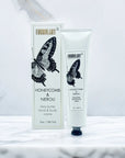 Shea butter hand and body crème with packaging featuring a butterfly design on a white background