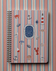 rifle paper co seaside spiral notebook on a striped background