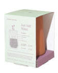 A terracotta-colored Modern Sprout water filter bottle inside its mint green and purple cardboard packaging, shown on a white background.
