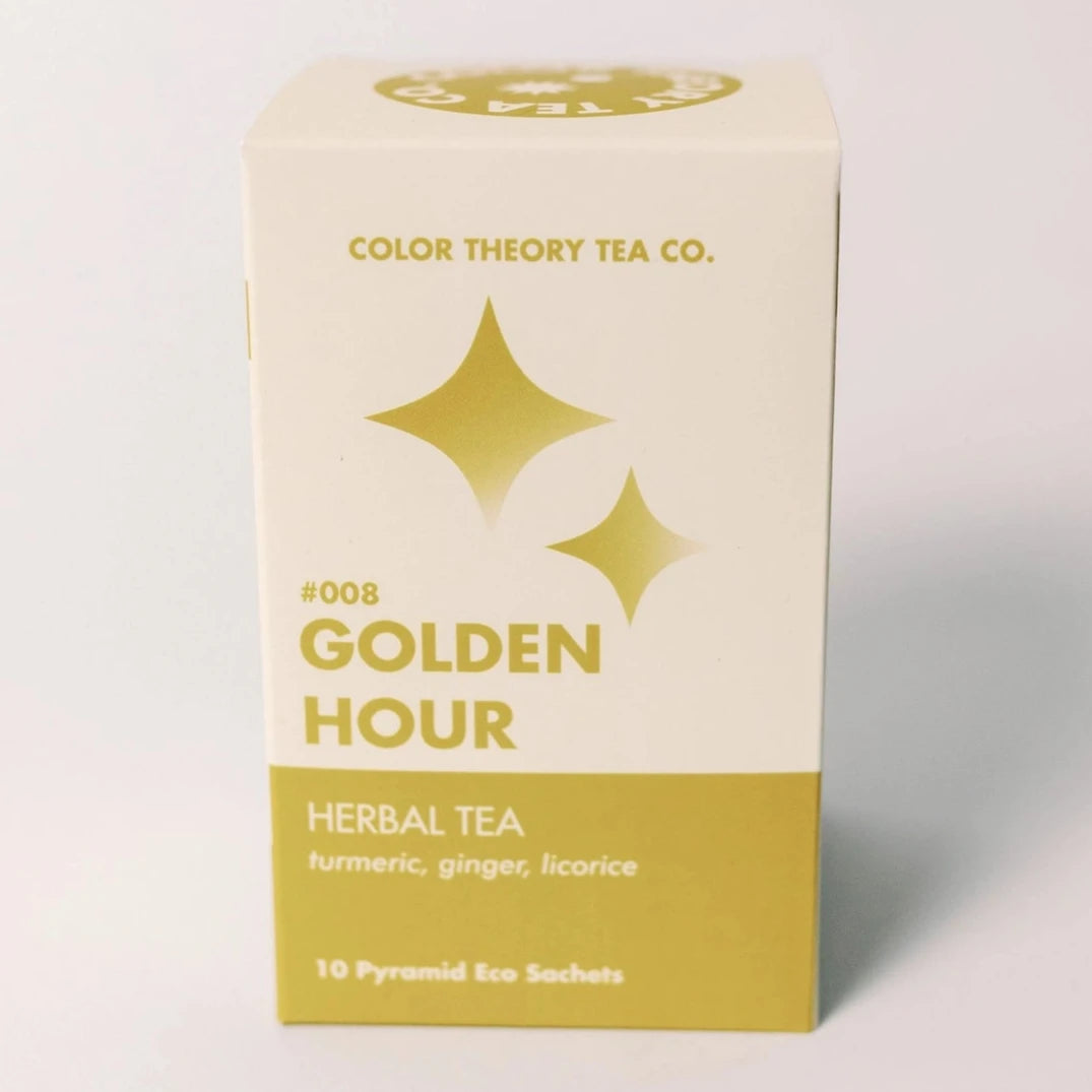 yellow tea box with sparkle design on it