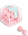 Clear cube box with pink heart-shaped candies and a bunny-themed label on a white background