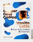 white packaging with blue spots like a cow and gold lettering that says "Copper Cow Coffee Vanilla Latte"
