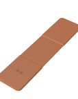 Brown folding mat with wireless charging symbol on a white background