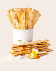 Puff pastry cups with a white cream filling on a light beige background