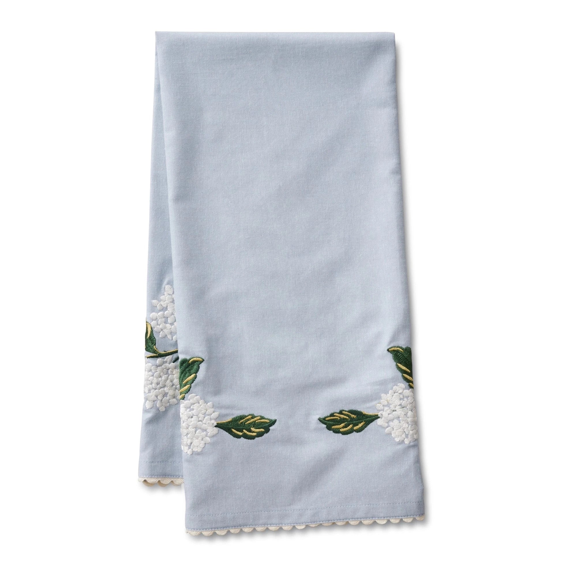 blue tea towel with white hydrangeas and green stems embroidered on it