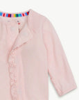 Pink baby outfit with colorful trim on a white background