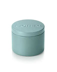 Small teal container with a lid on a white background