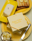 Butter yellow matches on a plate with toast and butter