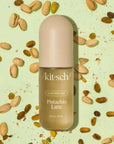kitsch pistachio latte on a green background with pistachios