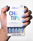 Hand holding a box of 'Chill Tips' with blue nail art, featuring the brand 'Chillhouse'.