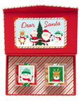 Red gift box with Christmas-themed cards featuring Santa and reindeer on a white background.