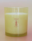 yellow leo candle on a pink and yellow candle