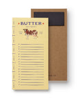 Butter measurement chart with cow illustration and brown cardboard backing on a white background