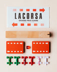Lacorsa Grand Prix Game components including track pieces and flags on a beige background