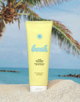 Yellow sunscreen tube with palm tree and beach background