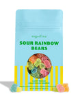 A light blue stand-up pouch of Sugarfina Sour Rainbow Bears candy mix bag, featuring a circular window showing colorful gummy bears and yellow vertical stripes at the bottom, set against a plain white background.