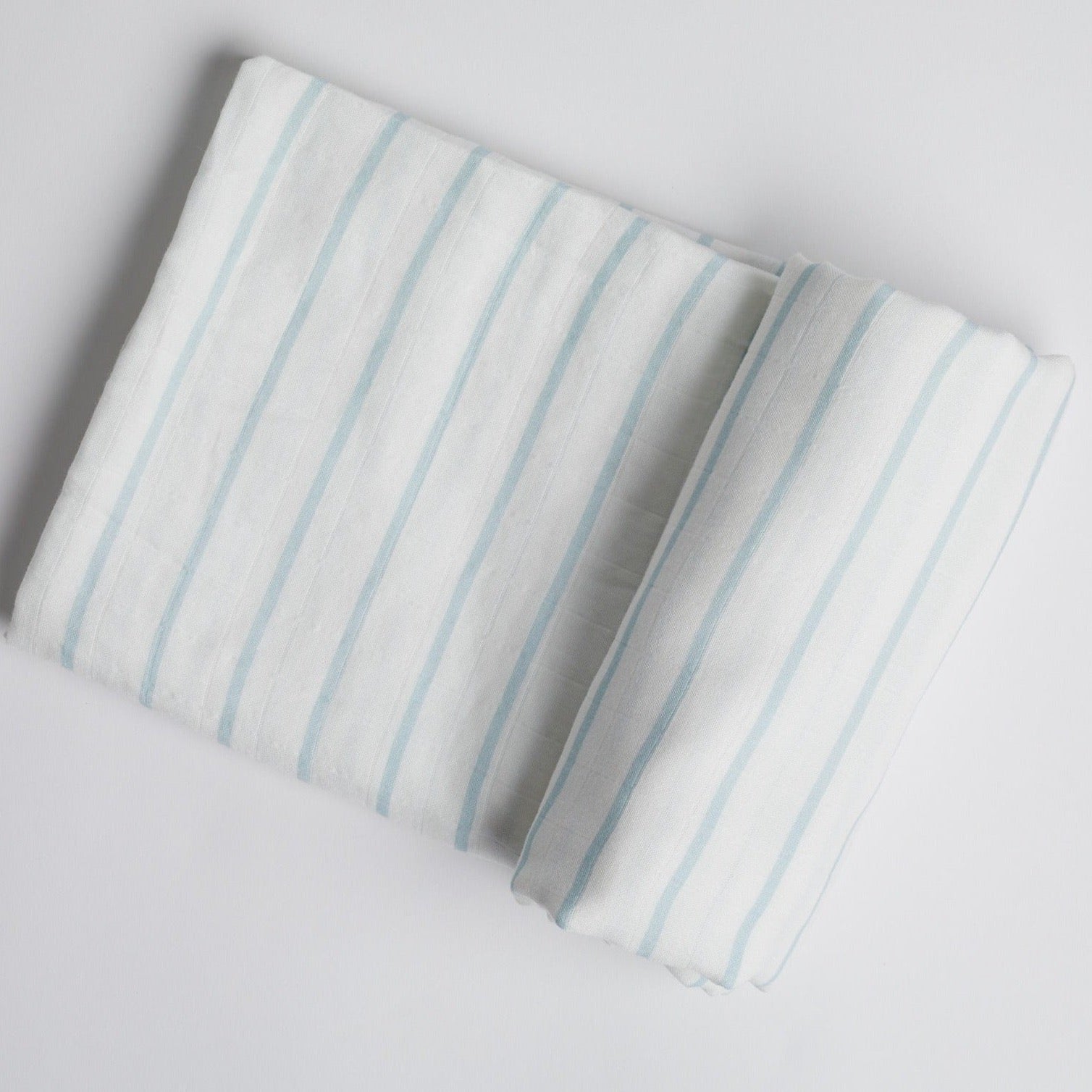 Powder Blue Stripe Swaddle on white background.
