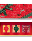 Red gift box with 'sugarfina' branding and candy packaging.