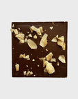 Chocolate bar with crumbled cookies on a white background