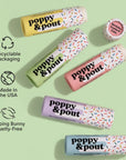 Poppy & Pout product packaging on a light green background with icons indicating recyclable packaging, made in the USA, and cruelty-free.