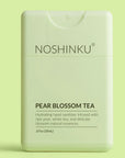 Noshinku Pear Blossom Tea hand sanitizer on a light green background
