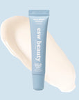 Blue skincare tube with 'esw beauty' branding on a light blue background