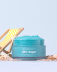 bright blue body scrub next to tiny yellow folding chair