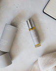 Two 'FOCUS' products on a textured surface with a notebook in the background.