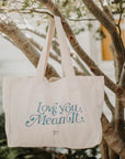 Tote hanging in tree reading love you mean it
