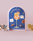 Cocktail Convo game packaging with cocktail-themed design on a light purple background