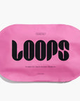 bright pink sheet mask that says 'LOOPS' on it