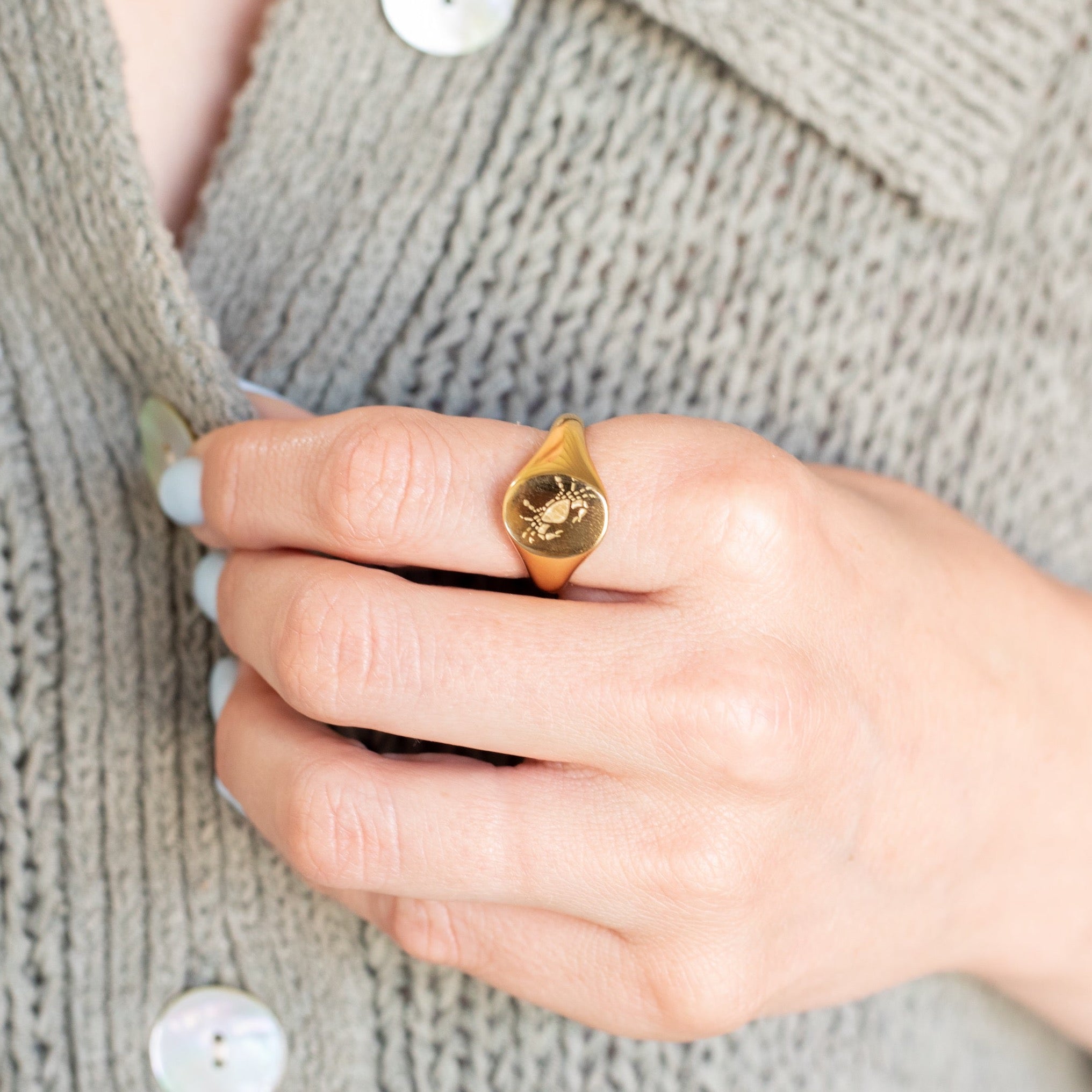 Girl wearing Cancer | Gold Plated Engraved Zodiac Ring on index finger