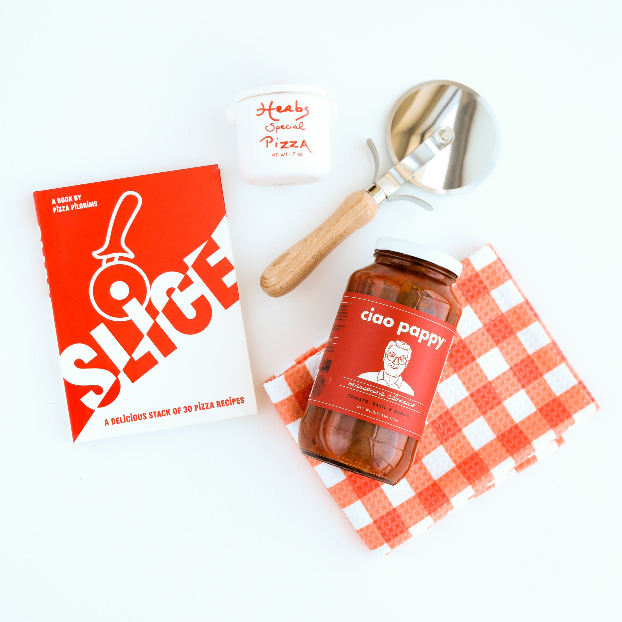  &quot;Slice&quot; Pizza book, wood pizza cutter, Ciao Pappy Marinara sauce, Pizza herbs jar and plaid red Geometry tea towel.