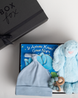 Baby gift set with blue plush bunny, hat, and book titled 'If Animals Kissed Good Night' from Box Fox.