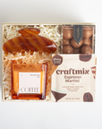 Gift set with a coffee-themed candle, decorative item, and craftmix espresso martini mix.