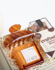 Gift set with coffee-themed items including a wooden coffee scoop, a small box labeled 'COFFEE', and a package of 'craftmix Espresso Martini'.