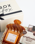 Gift basket with coffee and craft cocktail mix, branded 'Box Fox'.
