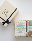 Box Fox gift set with 'Breathe, Mama, Breathe' book and self-care items on a white background