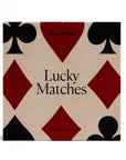 Matches packaging with playing card symbols on a beige background