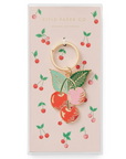 Cherry-themed keychain on a branded card with 'Rifle Paper Co.' branding.