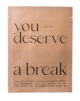 Kraft paper face mask packaging with 'you deserve a break' text on a white background