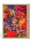 Jigsaw puzzle box with colorful floral design and 'Piecedwork Puzzles' text.