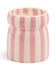 Cylindrical ceramic vase with pink and white vertical stripes on a white background