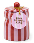 red and pink striped candle with a pink peppermint tag on