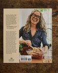 Book cover with a person on a wooden surface